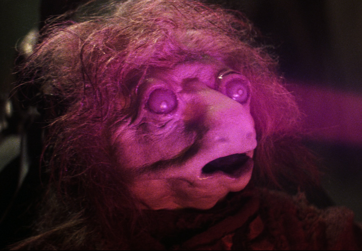 [The Dark Crystal draining the life essence from a podling]